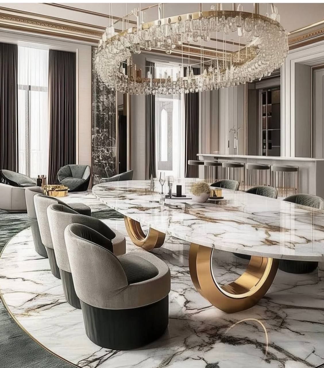 Dining room with a marble table on gold ring bases under a crystal chandelier